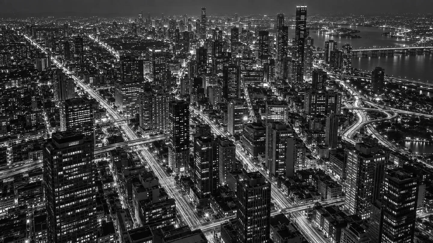 A monochrome cityscape crossed by long trails of light.